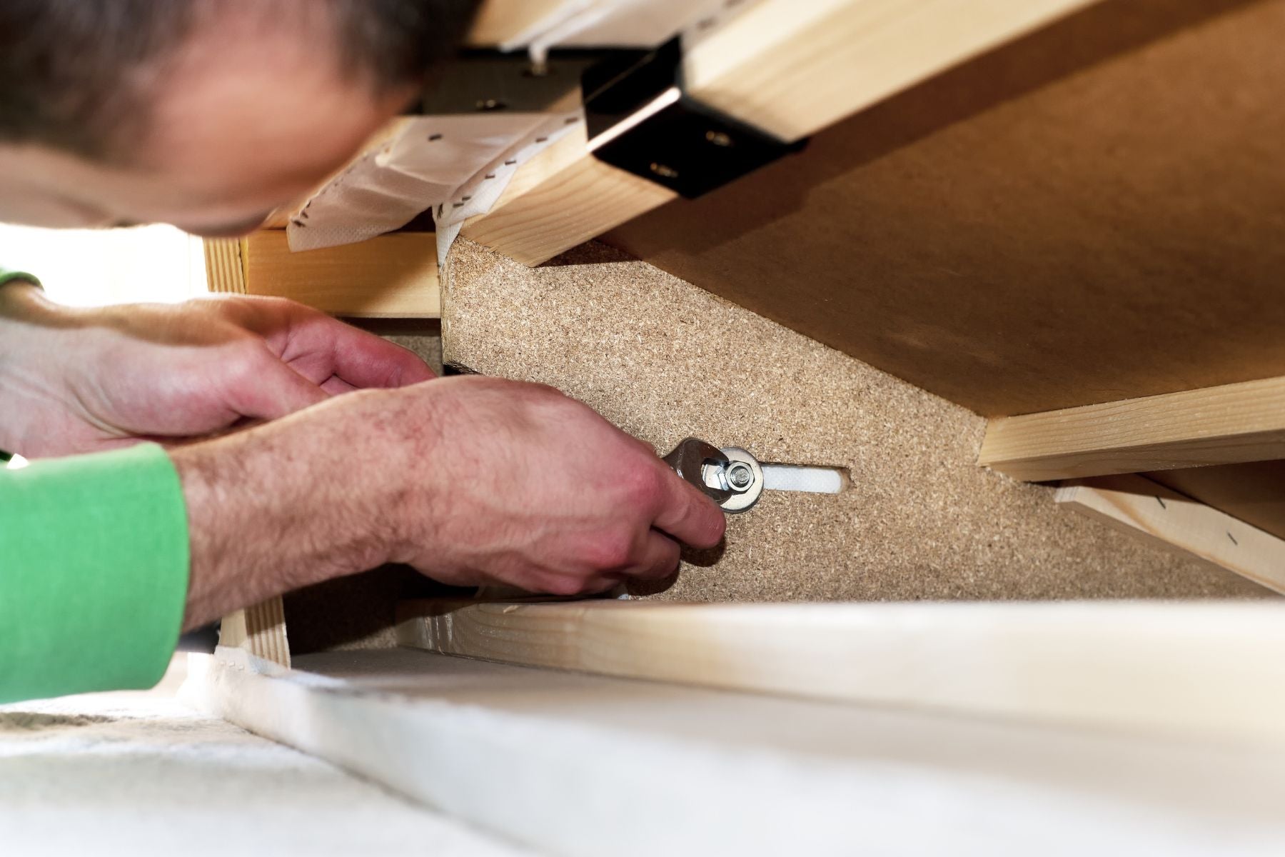 Man repairing sofa